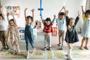 children stretching in classroom
